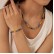 Jewelry factory fashion niche high -level high -level black gallstone resin stainless steel bracelet necklace jewelry set women